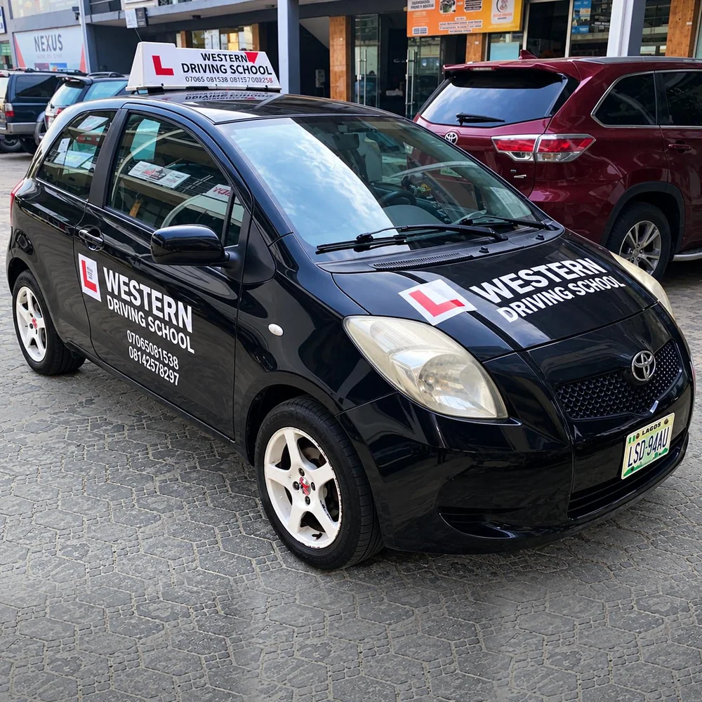WDS training vehicle, black Toyota Yaris with Western Driving School livery